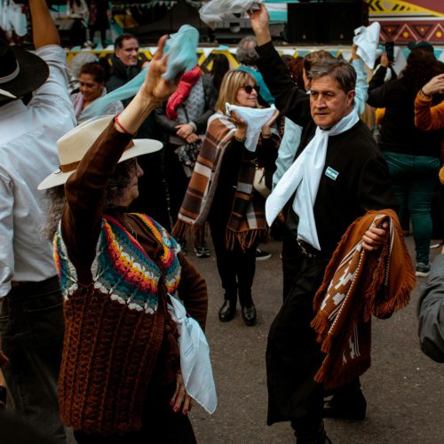 People enjoy traditional dancing at a cultural festival in Buenos Aires, Argentina.